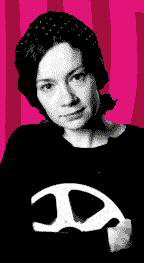Luisa Prosser as Delia holding a tape